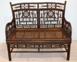 Heavily Carved Bamboo Settee with Cane Seat