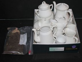 Miniature Tea Set and China Doll one leg missing