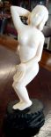 Carved Ivory Nude Bathing Beauty Carved ivory nude bathing beauty mounted on a carved teak base - 4 1/2