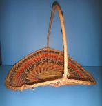 Unusual Shaped Choctaw Basket with Handle Unusual Shaped Choctaw Basket with Handle in tan, yellow, rust, dark brown, green and black; 17 1/2