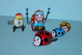 Vintage Wind-Up Toys Description: Vintage Wind-Up Toys; bird, ladybug family parade, man skiing; all working