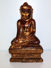 Wood Carved Buddha Possibly Tibetan, hand carved, wooden Buddha with gold leaf highlights; 8