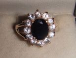 One stamped 14KT yellow gold lady's cast sapphire and aquamarine ring One stamped 14KT yellow gold lady's cast sapphire and aquamarine ring with a split shank with a bright polish finish. Containing: One prong set oval standard brilliant cut nat