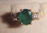 One stamped 14KT yellow gold lady's cast emerald and diamond ring One stamped 14KT yellow gold lady's cast emerald and diamond ring with a half round shank with a bright polish finish. Containing: One prong set oval standard brilliant cut natura