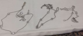 Three sterling Silver lady's Bezel set CZ chains Three sterling Silver lady's Bezel set CZ chains. Varying lengths. Total Weight of Chains 5.60 dwt