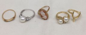 Five Various Lady's Rings One 14K rosecut ring; one pearl and diamond 14K ring; one 10K shell cameo ring; one pearl, diamond, and aquamarine, 14K; one 14K wishbone ring. Sizes Vary.