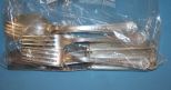  Niagra Silverplate Consisting of 4 Knives, 2 serving spoons, and 4 forks.