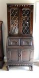 Twentieth century oak Jacobean style fall front secretary bookcase ; 29 1/2