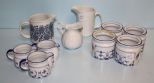 Four Candleholders & Creamers
