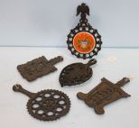 Five Cast Iron Trivets