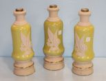 Three Yellow and White Lamp Bases