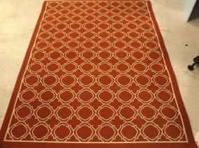 White and Rust Colored Machine Made Rug
