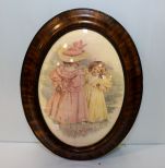 Oval Walnut Frame With Print of Two Girls