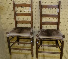 Two Wood Chairs with Deer Skin Seats