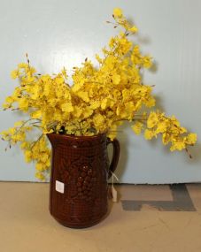 Brown Pottery Pitcher with Yellow Flowers