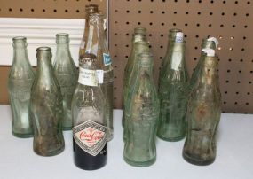 Fourteen Assorted Cola Bottles