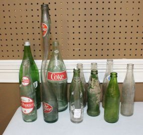 Twelve Assorted Cola Bottles