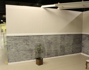 Half White Pegboard and Half Faux Brick Eight Foot Wall