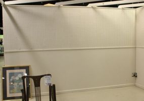 White Eight Foot Pegboard Wall