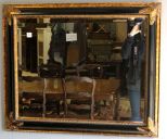 Beveled Mirror in Carved Black and Gold Frame