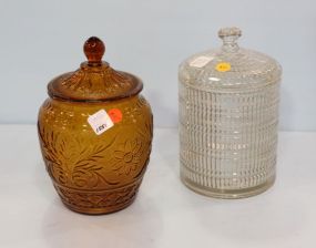 Two Glass Covered Jars