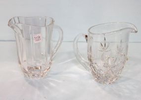 Two Clear Glass Pitchers