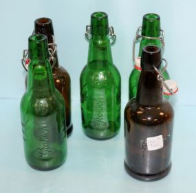 Three Green Grolsch Bottles & Two Brown Bottles