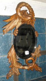 Ornately Carved Dragon Surrounding an Oval Beveled Mirror