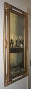 Gold mirror with carved corners