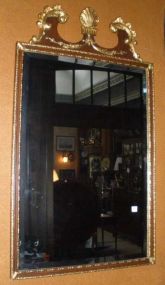 Large beveled mirror with gold trimmed frame