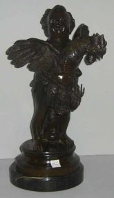 Bronze child figure holding a rooster on marble base