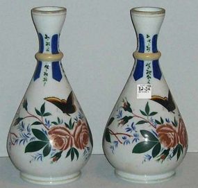 Pair of white hand painted vases with flowers
