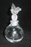 Clear perfume bottle with bird stopper