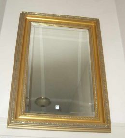Large gilt framed beveled mirror