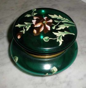 Small green hinged powder box with flowers
