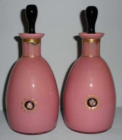 Pair of pink glass perfume bottle with black trim & enameled flowers