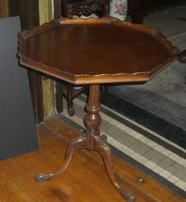 Mahogany octagonal top table with carved base snake legs