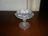 Small cut glass compote with folded in sides