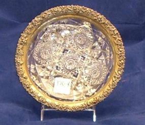 Small cut glass dish with sterling silver flower carved band