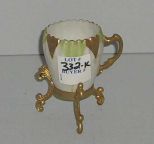Small White Demi Cup on Gold Metal Stand