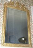 Gilt framed XVIII century classic design beveled mirror
