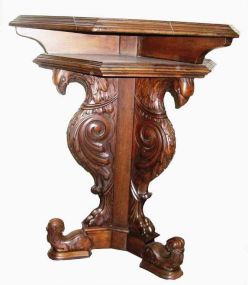 Pair of walnut tables with three detailed carved eagles as base supports