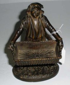 Bronze Man Holding Large Basket