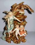 Figural Angel on Mountain Shielding 2 Children from an Eagle