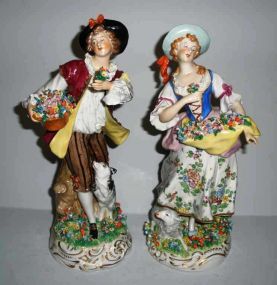Pair of Sitzendorf Dresden large man & woman figural with flowers