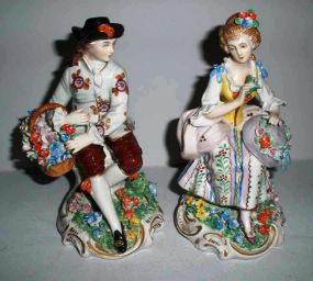 Pair of Dresden Sitzendorf  figures man & woman gathering flowers