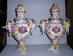 Pair of Dresden double handle urns with lids