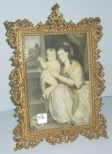 Brass ornate stand up picture frame with print of lady & baby