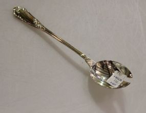 One Rocaille Sterling Salad Serving Fork by Erquis