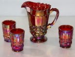 Carnival Glass Pitcher & Three Glasses 